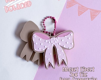 May include: A pink bow-shaped magnet fidget with white polka dots and a brown outline, attached to a pink beaded chain. The image includes the text "Digital Download" and "Magnet Fidget 3MF File Small Commercial Use Included."