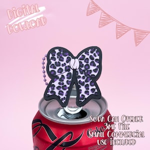 May include: A soda can opener with a bow-shaped design featuring a black outline and purple leopard print pattern. The opener is attached to a red soda can. Text on the image includes "Digital Download" and "Soda Can Opener".