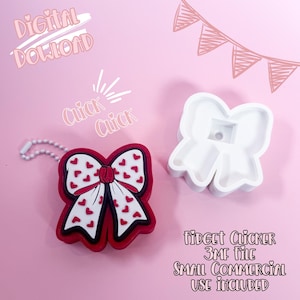 以下が含まれることがあります： ハート模様の赤、白、黒のリボン型フィジェットクリッカーと、白いリボン型の型。画像には、ピンクの背景に「Digital Download」、「Click Click」、「Fidget Clicker 3MF File」、「Small Commercial Use Included」というテキストが含まれています。