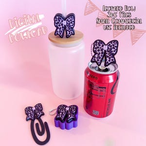 May include: A selection of leopard print bow accessories, including a straw topper, a can topper, a paperclip, and a purple base. The accessories are displayed with a glass tumbler and a red soda can. The image includes the text "Digital Download" and "Leopard Bow 3MF Files Small Commercial Use Included."