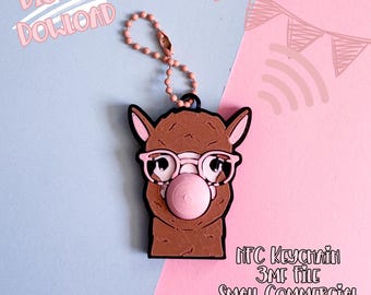May include: A brown llama keychain with pink glasses and a bubblegum bubble. The keychain has a pink beaded chain and is set against a pink and blue background. Text in the image reads "DIGITAL DOWNLOAD".
