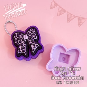 May include: A purple bow-shaped fidget clicker with a leopard print design, attached to a beaded chain. The image also shows a mold for the clicker, and text that reads "Digital Download" and "Fidget Clicker 3MF File Small Commercial Use Included."