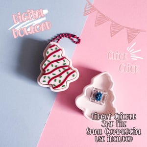 May include: A festive Christmas tree charm with red and green icing details, connected to a red beaded chain. A white tree-shaped container holds a small blue and clear object. Text includes "Digital Download" and "Fidget Clicker".