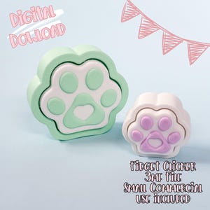 Puede incluir: Dos clickers antiestrés con forma de pata. Uno es verde menta y blanco, el otro blanco y lavanda. También se ve el texto "Digital Download" y "Fidget Clicker 3MF File Small Commercial Use Included".