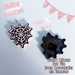 May include: A black and white spiderweb-shaped fidget clicker with a keychain, and a separate black fidget clicker component. The words "Digital Download" and "Click Click" are written on the image. The text "Fidget Clicker 3MF File Small Commercial Use Included" is also visible.