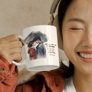 May include: White ceramic mug featuring a watercolor illustration of a couple under an umbrella. The mug has text that reads "SORRY I CAN'T MY C-DRAMA BOYFRIEND IS WAITING". The design includes a romantic theme.
