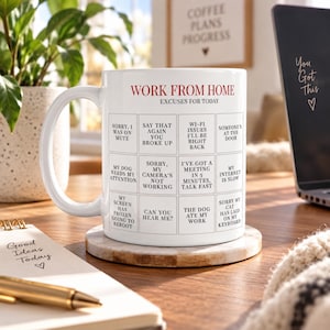 May include: A white ceramic mug featuring a red and black grid design titled WORK FROM HOME EXCUSES FOR TODAY. The grid contains twelve squares with phrases like SORRY I WAS ON MUTE, WI-FI ISSUES, MY DOG NEEDS MY ATTENTION, and MY INTERNET IS SLOW.