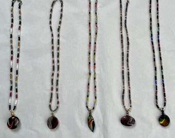 Hand made glass beaded necklace with hand made clay pendant 8”