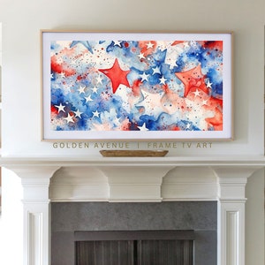 May include: A watercolor painting of a red, white, and blue American flag with stars. The stars are painted in a loose, abstract style. The painting is framed in a gold frame and is hanging above a fireplace.