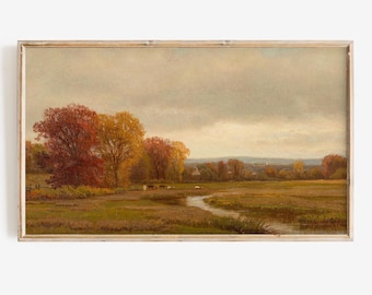 May include: An antique landscape painting in a wooden frame. The artwork depicts a serene autumn scene with a river, trees in vibrant red and yellow hues, and a cloudy sky. The painting evokes a sense of tranquility.