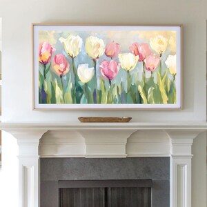 May include: A framed painting of a field of pink, white, and yellow tulips with green leaves and stems against a light blue and yellow background.