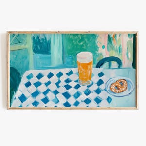 May include: A painting depicting a glass of beer and a pretzel on a blue and white checked tablecloth. The background is a blurred green and blue scene.