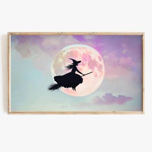 May include: A silhouette of a witch flying on a broomstick in front of a large, pink moon. The background is a soft purple and blue watercolor sky.