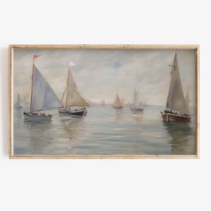May include: A painting of a seascape with several sailboats on a calm, blue body of water. The sky is a light blue with white clouds. The sailboats are white and have brown hulls. The painting is framed in a light wood frame.
