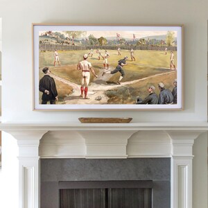 May include: A framed vintage illustration of a baseball game in progress. The players are wearing white uniforms with red accents. The field is green and the background shows a town with trees and buildings.
