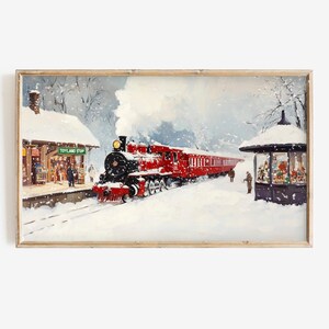 May include: A red steam train pulls into a snowy station with a Toyland Stop sign. The train is covered in snow and the station is decorated with Christmas lights.