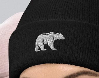 May include: Black beanie with a white embroidered bear design.