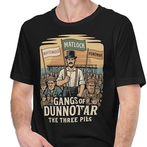 May include: Black t-shirt featuring a vintage-style illustration. The design includes a man holding a flag with the word "MATLOCK" and the text "GANGS OF DUNNOTAR THE THREE PIES". Other flags read "WHYTEWOLD" and "PONEMAH".