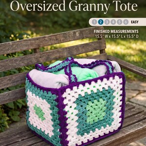 May include: An oversized granny square tote bag made of chunky yarn in purple, white, and shades of green. The bag features a square base and sides with a crochet pattern. Text on the image reads Oversized Granny Tote, Finished Measurements 15.5" W x 15.5" L x 15.5" D.