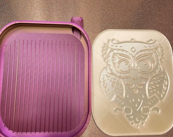 May include: Two 3D printed boxes, one is a light purple color with a textured surface and the other is a light beige color with a detailed owl design.