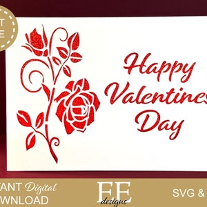 May include: A white card with red glitter lettering that says "Happy Valentines Day". A red glitter rose with a stem and leaves is on the left side of the card.