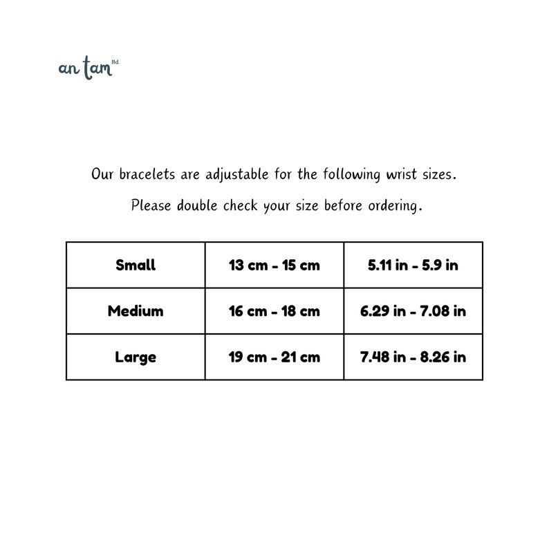 May include: White background with text and a table showing bracelet wrist sizes. The table includes sizes Small (13-15 cm), Medium (16-18 cm), and Large (19-21 cm). The brand name "an tam" is at the top.