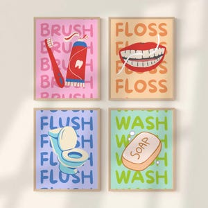 Puede incluir: Cuatro láminas enmarcadas para el baño. Las láminas presentan ilustraciones de un cepillo de dientes y pasta dental, una boca con hilo dental, un inodoro y una pastilla de jabón. Cada lámina tiene un color de fondo diferente y una palabra relacionada.