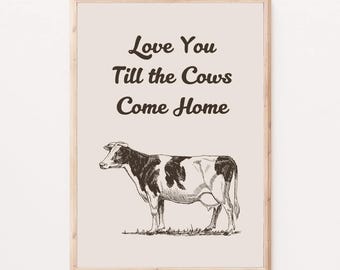 May include: A framed print with a black and white illustration of a cow and the text "Love You Till the Cows Come Home."
