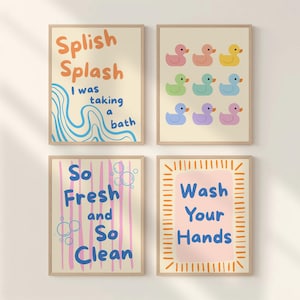 May include: Four framed bathroom art prints. One print says "Splish Splash I was taking a bath" with blue and orange text. Another shows colorful duck illustrations. The third says "So Fresh and So Clean". The last says "Wash Your Hands".