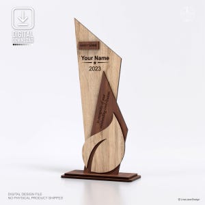 May include: A wooden award with a light wood grain finish, featuring a geometric design. The award includes the text "Your Name" and "2023", with the words "in recognition of your outstanding contribution". The base is a dark brown color.