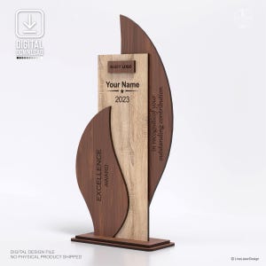 May include: A wooden excellence award with a light wood center and dark wood accents. The award features the text "Your Name" and "2023". The words "Excellence Award" and "in recognition of your outstanding contribution" are also visible.