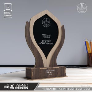 May include: A wooden trophy with a dark center and light wood accents. The trophy reads "PRESENTED FOR YOUR LIFETIME ACHIEVEMENT" and includes space for a name and the year 2025. The design is from Line Laser Design.