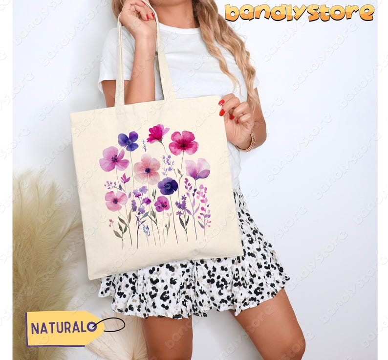 Our wildflower tote bag features a delicate watercolor floral design in dreamy purples and pinks. This eco-friendly canvas bag is perfect for errands, books, or farmers’ market hauls. Lightweight yet sturdy, it’s the ultimate blend of style and function for flower lovers and cottagecore fans alike!