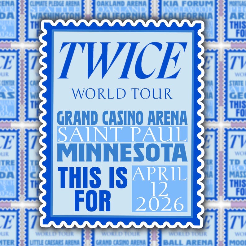 May include: A light blue sticker with a scalloped edge featuring the text "TWICE WORLD TOUR" and event details. The sticker highlights "Grand Casino Arena, Saint Paul, Minnesota" and the date "April 12, 2026."