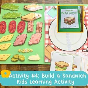 May include: A learning activity set featuring a green folder with various laminated sandwich ingredient cutouts including lettuce, tomato, bacon, cheese, ham, pickles, and condiments. It includes a plate mat and challenge cards.