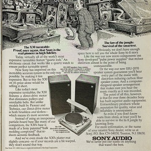 May include: A vintage advertisement for Sony audio equipment. The ad features a black and white illustration of a man holding a turntable. The text highlights the features of the X30 turntable, including its quartz lock, direct-drive motor, and slotless design. The ad also mentions the SSU-2070 speaker system, which features carbon fiber speaker cones and a computer-designed speaker arrangement.
