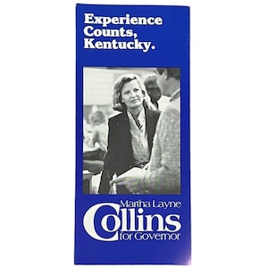 May include: A blue and white campaign poster for Martha Layne Collins for Governor of Kentucky. The poster features a black and white photo of Collins speaking with a man. The text on the poster reads "Experience Counts, Kentucky." and "Martha Layne Collins for Governor."