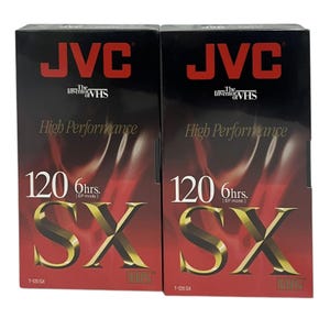May include: Two black VHS tapes with gold lettering. The tapes are labeled "JVC The Inventor of VHS High Performance 120 6hrs [EP mode] SX T-120 SX VHS"