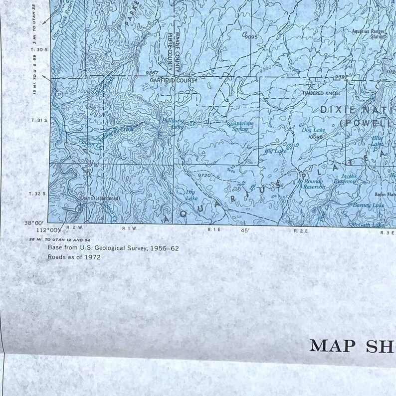 May include: A vintage map of the Aquarius Range in Utah, showing the Dixie National Forest, Powell Plateau, and the surrounding area. The map is printed on blue paper and includes topographic lines, rivers, lakes, and other geographical features. The map is dated 1956-62 and shows roads as of 1972.