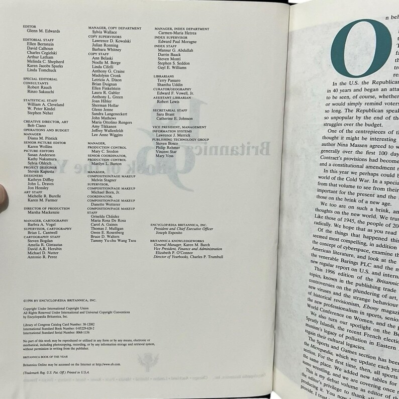 May include: An open book with text on the right page and a list of staff on the left. The text includes a large letter "O" and discusses the Republican party and the Cold War.