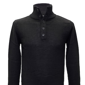 May include: A black long-sleeved sweater with a mock neck and a button placket.