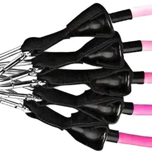May include: Resistance bands with black handles and clips, connected to pink tubes of varying shades. The bands are designed for exercise and fitness routines. The bands are connected to a black strap.