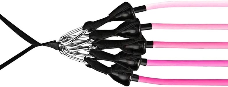 May include: Resistance bands with black handles and clips, connected to pink tubes of varying shades. The bands are designed for exercise and fitness routines. The bands are connected to a black strap.