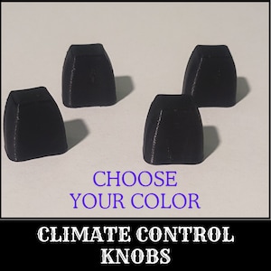 May include: Four black plastic knobs for a car's climate control system. The text "CHOOSE YOUR COLOR" and "CLIMATE CONTROL KNOBS" is printed below the knobs.