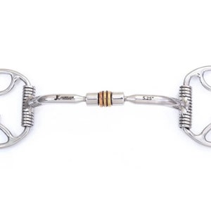 May include: A silver-colored horse bit with a curved mouthpiece and circular side pieces. The bit has a central section with gold-colored accents and the text "5.25" is visible. The brand name "JAMKAM" is also printed on the bit.