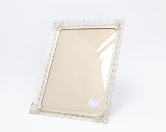 Beautiful, intricately detailed, silver-plated brass frame (18x24 cm) with rich ornamentation and curved glass; ML  Denmark (26-0042).