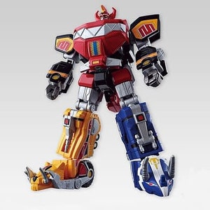 May include: A colorful toy robot with a red torso, yellow and blue legs, and black and yellow arms. The robot has a detailed design with silver accents and is posed against a white background. This toy is likely a collectible or a children's plaything.