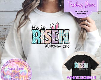 May include: White sweatshirt with a colorful patchwork design that says "He is Risen" with bunny ears and the text "Matthew 28:6".