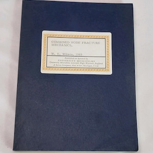 May include: A navy blue book with a white and gold label. The label reads "COMBINED MODE FRACTURE MECHANICS" and lists the author, W. K. Wilson, and the year 1969. The book is published by University Microfilms.