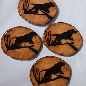 Rustic wood drink coasters with dog silhouette. This is a set of 4 coasters. With burnt in Silhouettes of Labrador retrievers.